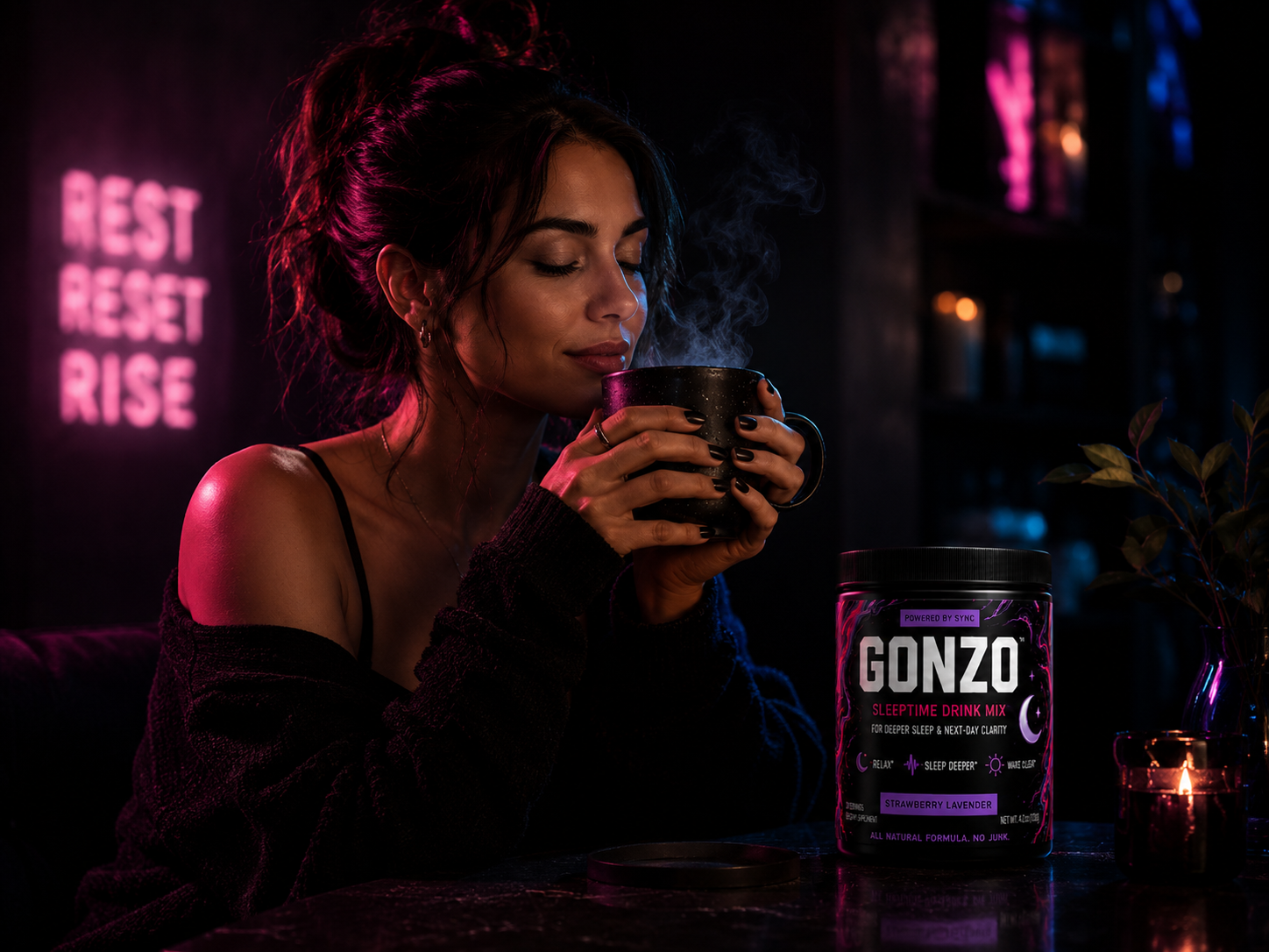 A woman unwinding with a warm mug beside GONZO Strawberry Lavender sleeptime drink mix